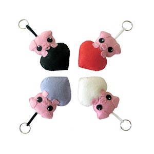 cochon kawaii dans un coeur rouge, mauve, noir ou ivoire, cadeau de saint valentin