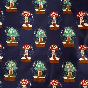 May include: A repeating pattern of whimsical snow globes on a navy blue background. Each globe features a mushroom house with a red or green cap, a brown base, and a dusting of white snow. The design is playful and fantasy-themed.