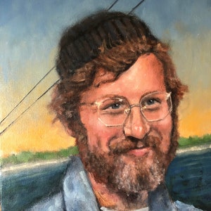 May include: Oil painting portrait of a man with a beard, glasses, and a denim jacket. The background features a blue sky and a hint of a sunset. The man is wearing a black cap.