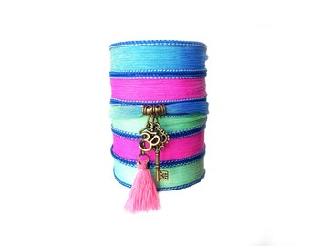 Silk ribbon wrap bracelet with key and Om charms