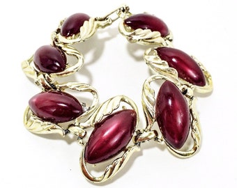 Vintage Dark Red Oval, LucitI Moonglow. thermoset/ thermoplastic, gold tone link bracelet. CHAREL Stye.