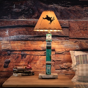 or choose the plain parchment shade Rustic Cabin/Lodge Style Lamp.The Redfish Lake Table Lamp w/Hand Carved Oars andFish in the Water Parchment Shade .