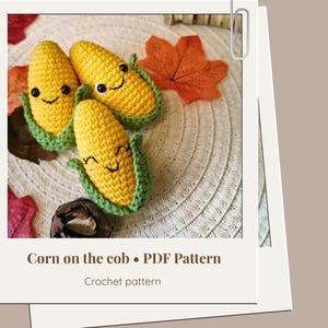 May include: Three handmade crochet corn on the cob toys with smiling faces. The corn is yellow with green husks. The text "Corn on the cob • PDF Pattern" and "Crochet pattern" is visible.