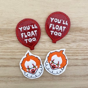 May include: Two red glittery balloon-shaped embroidered patches featuring the white text "YOU'LL FLOAT TOO" and two embroidered patches depicting a clown face with orange hair, a white ruffled collar, and a sinister expression on a white background.