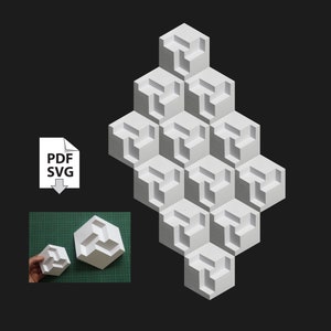 May include: A white 3D geometric paper model of a cube with a repeating pattern of interlocking cubes. The model is made of white paper and is assembled in a pyramid shape. The model is shown on a black background. PDF and SVG files are available for download.