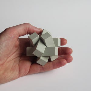 concrete 3D burr puzzle “Knot” chinese interlocking put together brainteaser cement gray gift architect brutalist think