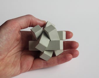 concrete 3D burr puzzle “Knot” chinese interlocking put together brainteaser cement gray gift architect brutalist think