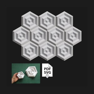 Puede incluir: Un conjunto de baldosas de pared blancas y geométricas con forma de panal, con un diseño en capas empotradas. La imagen también muestra una versión más pequeña de la baldosa en la mano y un icono PDF/SVG.