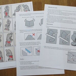 May include: Instructions for a papercraft model of the "Thinker" sculpture by Auguste Rodin. The instructions include diagrams showing how to fold and glue the paper to create the sculpture. The instructions also include a list of materials needed for the project.