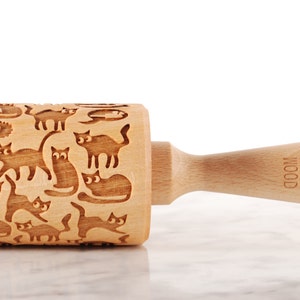 Wooden rolling pin laser engraved with design of cartoon funny cats.