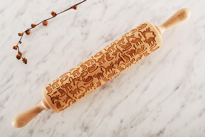 Wooden rolling pin laser engraved with design of cartoon funny cats.