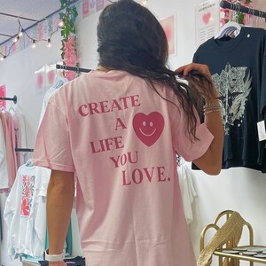 Create a Life You Love Tee | Blossom Pink Comfort Colors Trendy Aesthetic Smiley Face Heart T-Shirt