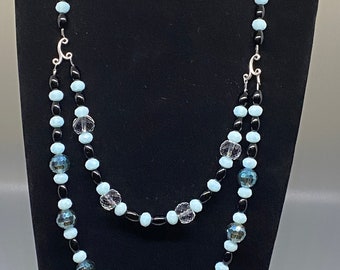Double strand cut crystal with light blue faceted glass bead and black onyx