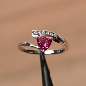 red ruby engagement ring July birthstone trillion cut sterling silver bypass ring
