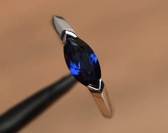 blue sapphire wedding ring September birthstone marquise cut gemstone sterling silver east west setting ring