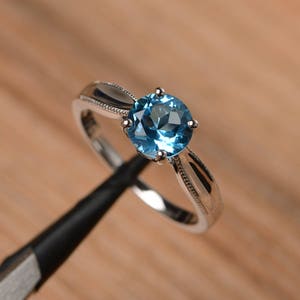 Swiss blue topaz solitaire engagement ring round cut sterling silver November birthstone