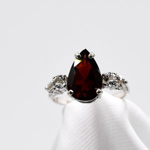 Garnet Ring,  Genuine Gemstones 12x8mm Pear Shaped 2+ cts With 3mm Genuine White Topaz Side Stones Set in 925 Sterling Silver Ring