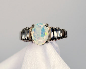 Ethiopian Opal Ring,9x7mm Faceted Oval, .83 carats,925 Sterling Silver, Ridged Mounting