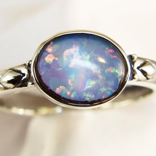 Blue Opal Ring, 10x8mm Cabochon Cut, Set East to West,  Set in a Carved 925 Sterling Silver Bezel Ring