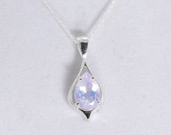 May include: A silver necklace with a pear-shaped lavender gemstone pendant.