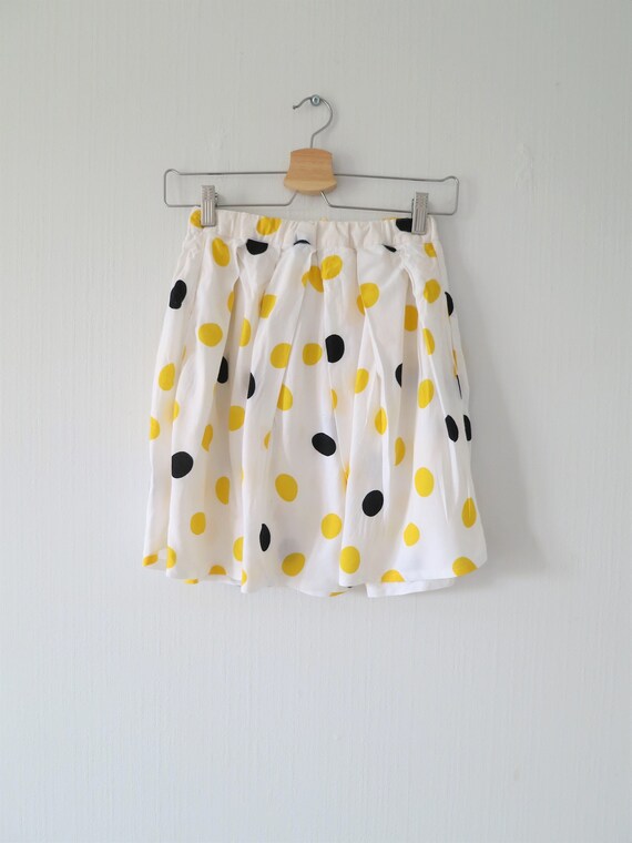 yellow and white polka dot skirt