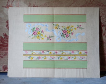 May include: A vintage paper with a decorative design featuring green horizontal stripes and floral patterns. The floral elements include pink and yellow flowers with light blue ribbon accents. The paper has a cream-colored background.