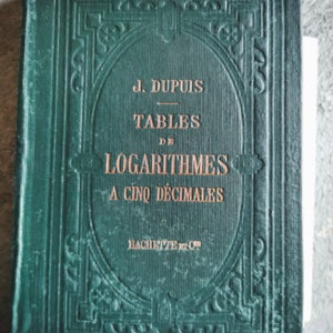 May include: A vintage green book titled "TABLES DE LOGARITHMES A CINQ DECIMALES" by J. DUPIUS. The cover has an embossed design and the text is in orange. The book is a mathematical reference.