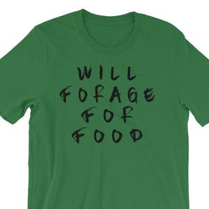 May include: A green t-shirt with the text "WILL FORAGE FOR FOOD" printed in black.