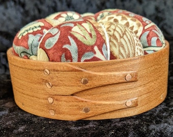 Handcrafted shaker pincushion with William Morris fabric