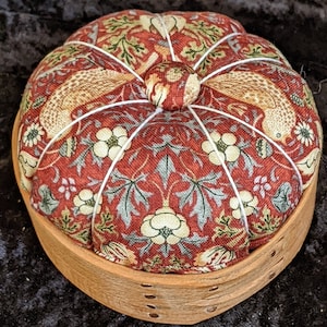 Handcrafted shaker pincushion with William Morris fabric