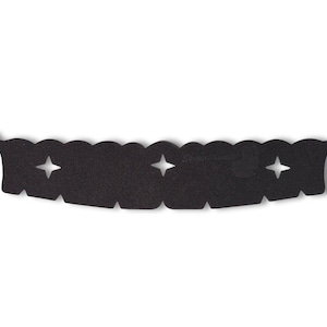 May include: Black, scalloped, fabric trim with three star-shaped cutouts. This trim is designed to be sewn onto a garment or other fabric project.