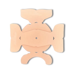 May include: A peach-colored cardboard box template for a gift box. The template is designed to be folded and assembled into a box with a circular base and a top that folds over the base.