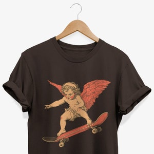 -shirt patineur Cupidon Angel | T-shirt graphique skateur rétro | Cadeau de Saint-Valentin pour les amateurs de skateboard