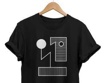 May include: Black t-shirt with a white geometric design featuring a circle, rectangle, and lines.