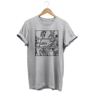 May include: A light gray t-shirt with a black floral design. The design features three rectangular panels, each showcasing a different section of a rose illustration. The shirt is hanging on a wooden hanger.