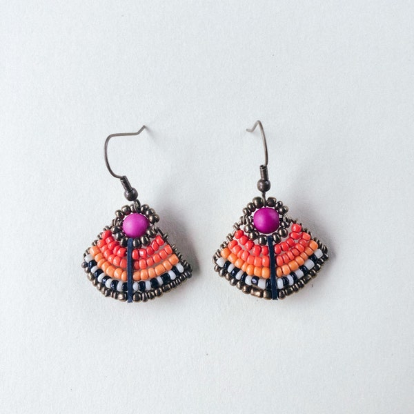 Fan earrings in magenta, and shades of orange with black and white and finished with gold seed beads.