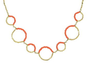 Orange and gold beaded ring necklace
