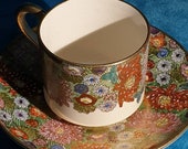 Vintage Japanese Satsuma thousand flower Millefiori tea cup and saucer. Koshida hand-painted. Gilding and moriage enamel beading. Post war.