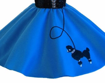May include: A bright blue circle skirt with a black poodle silhouette embroidered on the right side. The poodle is on a leash with a loop at the top.