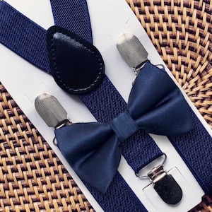 Navy bow tie and navy suspenders for a wedding.