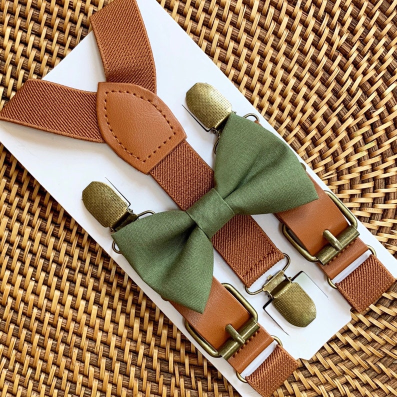 Cognac Brown Suspenders form a Y-Back for Men, Boys or Women. Bronze clips adhere suspenders to card on a woven brown background. Olive Green Bow Tie shown with suspenders. Perfect for Weddings, Boys, Men, Women, Ring Bearer Outfit, Gift, Groomsmen.