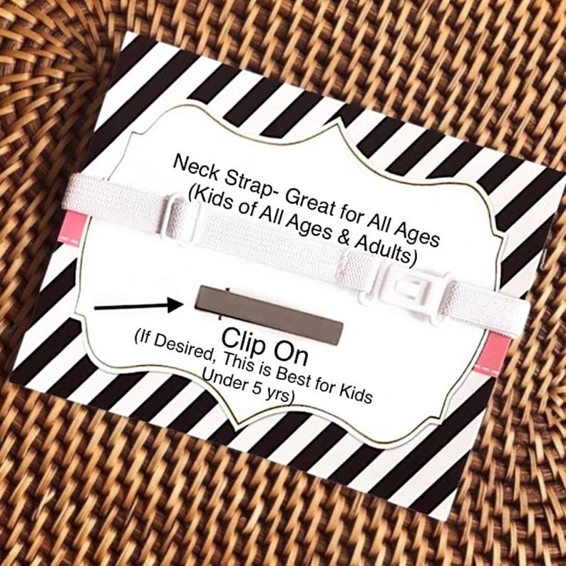 May include: White neck strap with a black and white striped background. The strap has a clip on feature and the text "Neck Strap- Great for All Ages (Kids of All Ages & Adults)" and "(If Desired, This is Best for Kids Under 5 yrs)" is printed on the background.
