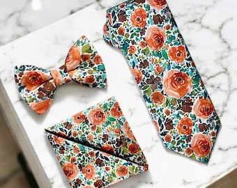 Zestaw krawatów Sunset Floral: spalone pomarańczowe krawaty, poszetki i muszki na wesele w stylu boho
