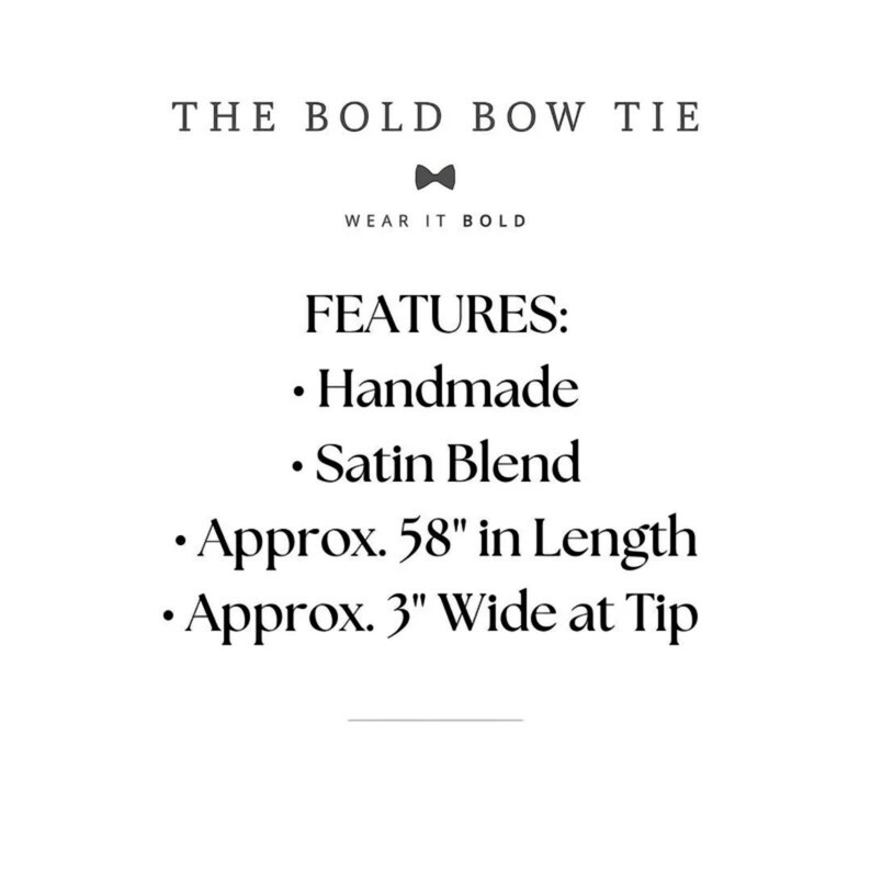 May include: A black bow tie with the text "THE BOLD BOW TIE" and "WEAR IT BOLD" above it. The text "FEATURES:" is followed by a list of features: "Handmade", "Satin Blend", "Approx. 58" in Length", and "Approx. 3" Wide at Tip".