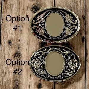 Two options of belt buckles: Option #1 has a leaf design and Option #2 has a floral design. Both are silver and black from The Bold Bow Tie.