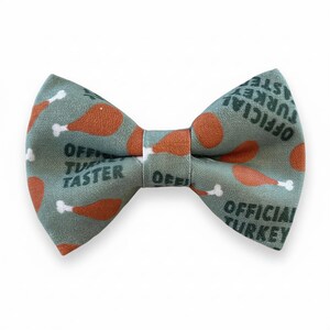 A bow tie with a pattern of orange and green turkey legs printed on it.