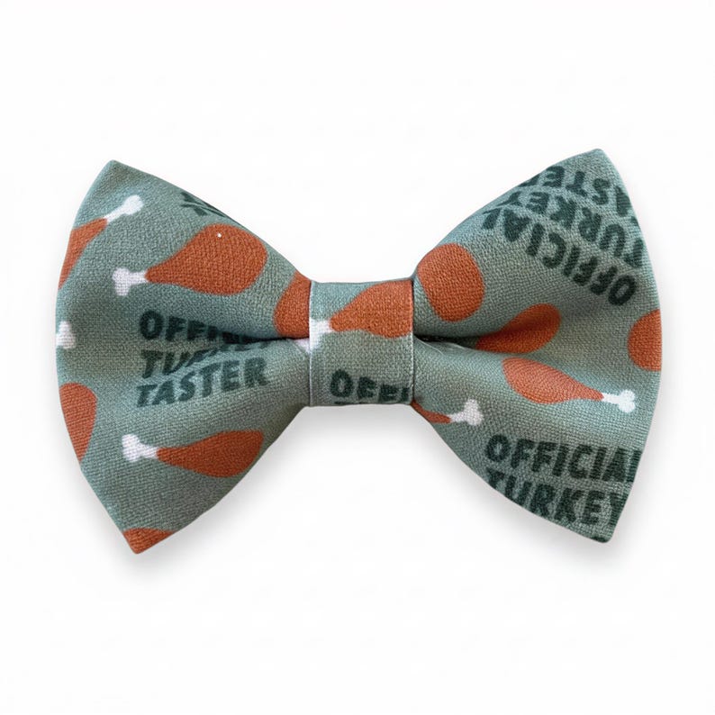 A bow tie with a pattern of orange and green turkey legs printed on it.