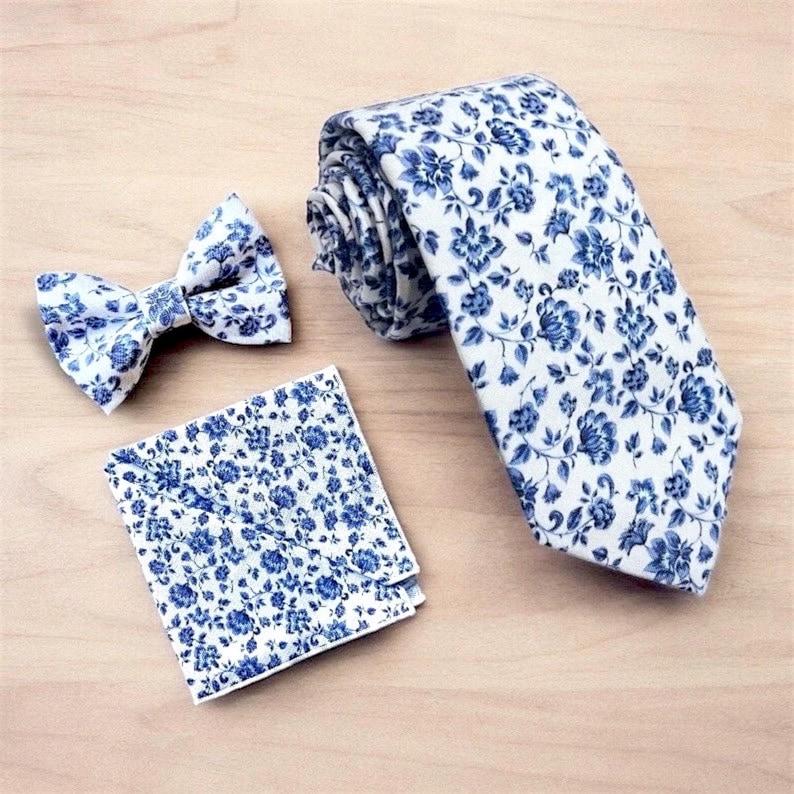 Dusty blue floral men’s tie for wedding and groomsmen.