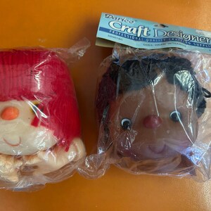 Buyer's Choice. New but Vintage Doll Head w/hands and yarn hair. A variety of different color of yarn hair. Various brands. Original package