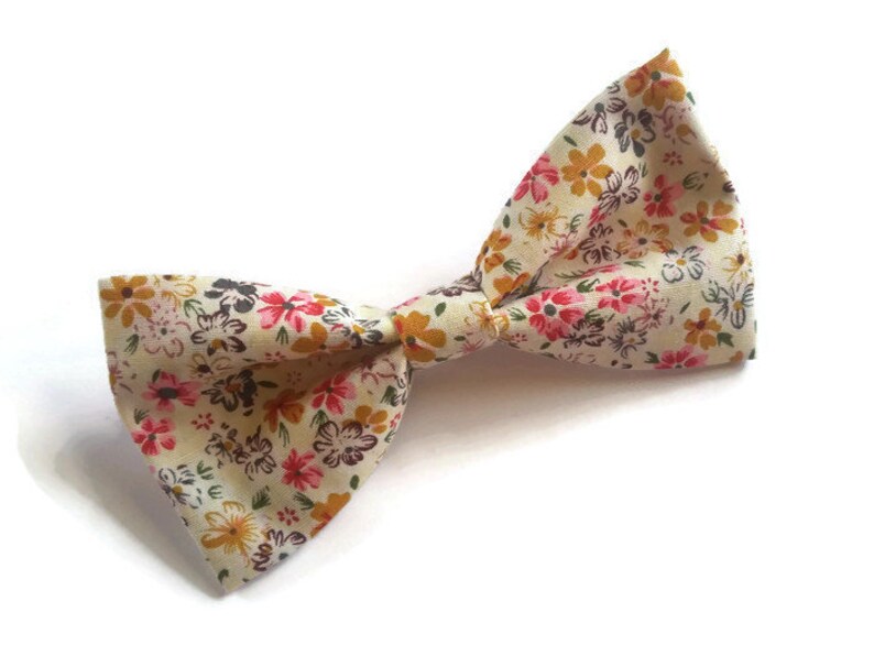 soft pink suspenders and ecru pink mustard floral bow tie for groom and groomsmaids fall wedding attire ideas for ring bearer best man